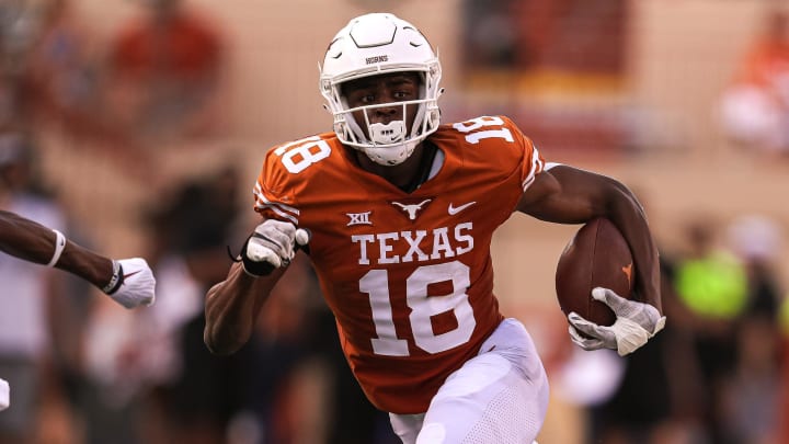 Wide receiver Isaiah Neyor runs with the ball during Texas' 2022  spring football game.