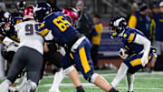 Central Catholic's Elijah Faulkner runs into a wall while trying to carry the ball in the first half of the PIAA Class 6A football championship game against St. Joseph's Prep at Cumberland Valley High School, Saturday, Dec. 7, 2024, in Silver Spring Township, Pa.