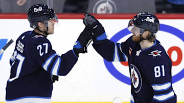 Feb 25, 2024; Winnipeg, Manitoba, CAN; \Winnipeg Jets left wing Kyle Connor (81) celebrates his overtime goal with Winnipeg Jets left wing Nikolaj Ehlers (27) against the Arizona Coyotes at Canada Life Centre. Mandatory Credit: James Carey Lauder-Imagn Images