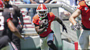 Apr 12, 2025; Athens, GA, USA; Georgia Bulldogs wide receiver Zachariah Branch (1) returns a kickoff during the Georgia Spring game at Sanford Stadium. Mandatory Credit: Dale Zanine-Imagn Images