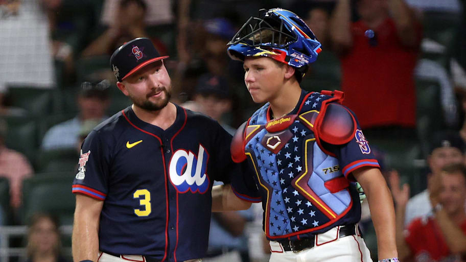 Seattle Mariners catcher Cal Raleigh reacts to winning the Home Run Derby alongside his brother Todd Jr. | Jordan Godfree-Imagn Images
