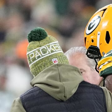 Green Bay Packers center Elgton Jenkins is helped off the field during the game against the Eagles.