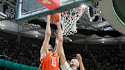 Jan 19, 2025; East Lansing, Michigan, USA;  Illinois Fighting Illini center Tomislav Ivisic (13) dunks the ball during the first half against the Michigan State Spartans at Jack Breslin Student Events Center. Mandatory Credit: Dale Young-Imagn Images