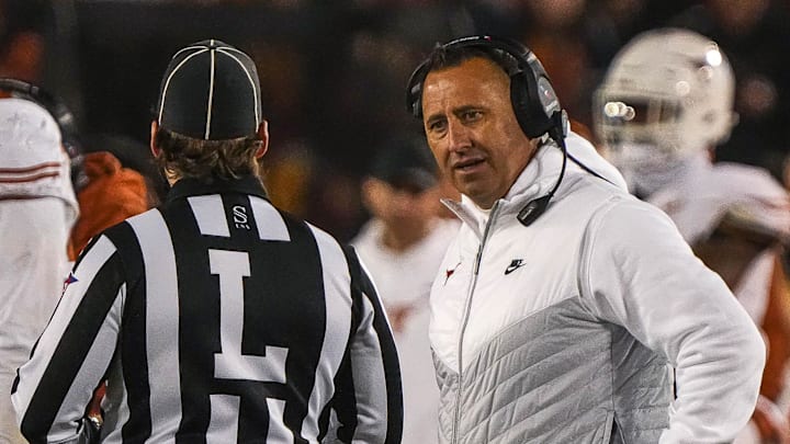 Nov 18, 2023; Ames, Iowa, USA; Texas Longhorns head coach Steve Sarkisian talks to an official after a call that negated a Longhorns touchdown during the game against the Iowa State Cyclones at Jack Trice Stadium. Mandatory Credit: Aaron E. Martinez-Imagn Images
