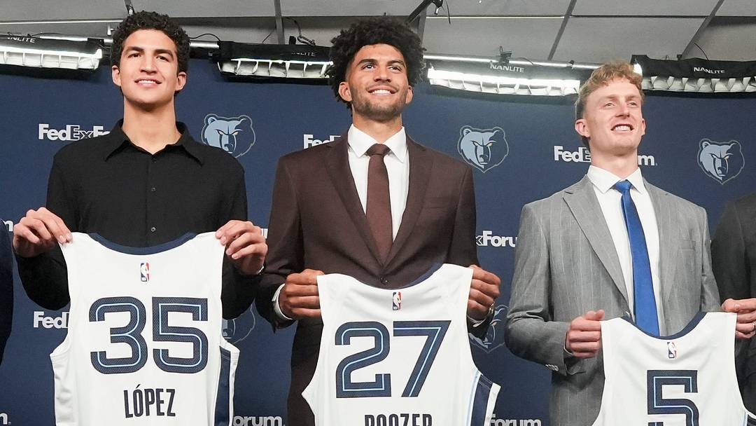 Grizzlies 2026 draft picks Karim Lopez, Cam Boozer and Richie Saunders pose for photos with their New Jerseys next to Zach Kleiman, general manager and executive vice president of basketball operations, and head coach Tuomas Iisalo after the players’ introductory press conference at FedExForum in Memphis, Tenn., on June 25, 2026. Grizzlies 2026 draft picks Karim Lopez, Cam Boozer and Richie Saunders pose for photos with their New Jerseys next to Zach Kleiman, general manager and executive vice president of basketball operations, and head coach Tuomas Iisalo after the players’ introductory press conference at FedExForum in Memphis, Tenn., on June 25, 2026.
