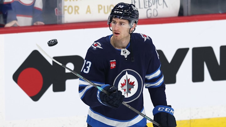 Jan 2, 2025; Winnipeg, Manitoba, CAN; Winnipeg Jets center Gabriel Vilardi (13) puck juggles before a game against the Anaheim Ducks at Canada Life Centre. Mandatory Credit: James Carey Lauder-Imagn Images