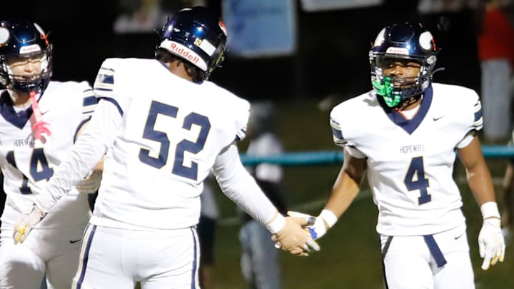 Hopewell's Nasir Wade high-fives a teammate during a win over Freeport. The Vikings received a wild card to the WPIAL Class 3A playoffs and will return to the playoffs for the first time since 2012.