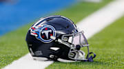 A Tennessee Titans helmet rests on the goal line