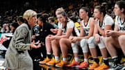 Jan Jensen coaching her Iowa Hawkeyes team during a timeout