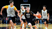 Iowa Hawkeyes guard Bennett Stirtz driving on his teammates