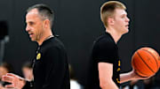 Iowa Hawkeyes head coach Ben McCollum and guard Bennett Stirtz