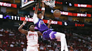 Utah Jazz forward Ace Bailey (19) dunks the ball as Houston Rockets guard Amen Thompson (1) defends during the second quarter at Toyota Center.