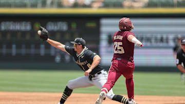 May 25, 2024; Charlotte, NC, USA; Florida State catcher McGwire Holbrook (25) gets out at first base by Wake Forest first baseman Nick Kurtz (8) in the second inning during the ACC Baseball Tournament at Truist Field.