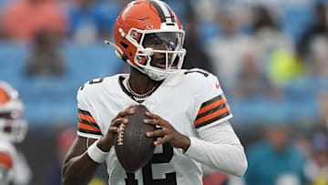 Cleveland Browns quarterback Shedeur Sanders (12)j drops back to pass against the Carolina Panthers during the first quarter at Bank of America Stadium.