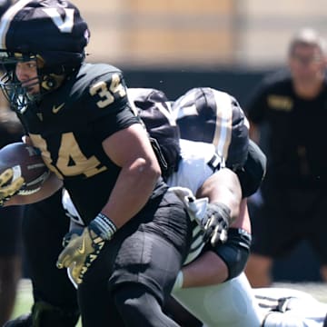 Vanderbilt running back Johann Cardenas (34) runs during the Vanderbilt Football Black and Gold Spring Game at FirstBank Stadium in Nashville, Tenn., Saturday, April 12, 2025.