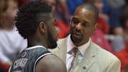 UNLV Runnin' Rebels assistant coach Stacey Augmon (right) talks with guard Jordan Cornish (3) against the New Mexico Lobos at The Pit Arena. UNLV defeated New Mexico 76-68. 