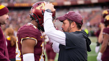Gophers defensive coordinator and safeties coach Danny Collins with Kerry Brown. 