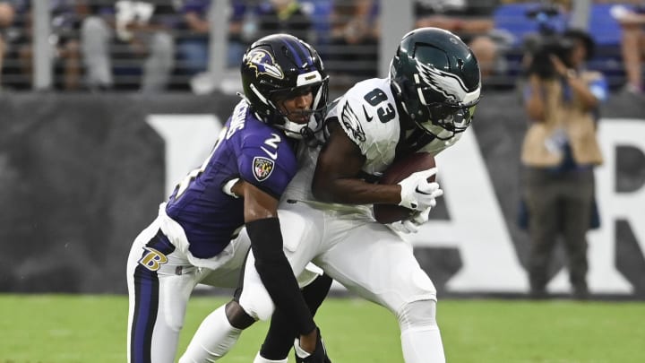 Aug 9, 2024; Baltimore, Maryland, USA;  Philadelphia Eagles wide receiver John Ross (83) makes catch in front of Baltimore Ravens cornerback Nate Wiggins (2) during the first  quarter of a preseason game at M&T Bank Stadium. Mandatory Credit: Tommy Gilligan-USA TODAY Sports