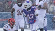 Buffalo Bills cornerback Christian Benford celebrates sacking Cincinnati Bengals quarterback Joe Burrow.