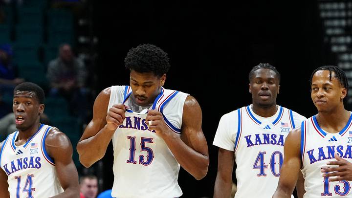 Nov 24, 2025; Las Vegas, Nevada, USA; Kansas Jayhawks guard Melvin Council Jr. (14), forward Bryson Tiller (15), forward Flory Bidunga (40), guard Elmarko Jackson (13) and guard Tre White (3) walk back onto the court after a timeout against the Notre Dame Fighting Irish during the first half in a 2025 Players Era Festival group play game at MGM Grand Garden Arena. Mandatory Credit: Stephen R. Sylvanie-Imagn Images