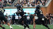 Wake Forest running back Demond Claiborne gets the handoff from quarterback Robby Ashford against North Carolina.