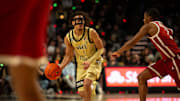 Wake Forest point guard Nate Calmese dribbles the ball against Oklahoma 