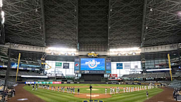 The Milwaukee Brewers and Chicago White Sox stand for the National Anthem opening day ceremonies on