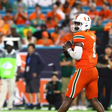 Miami Hurricanes quarterback Cam Ward (1) drops back to pass against the Florida A&M Rattlers during the third quarter at Hard Rock Stadium in Miami Gardens, Florida. Mandatory Credit: Sam Navarro-Imagn Images