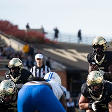 Wake Forest quarterback Deshawn Purdie (5) taking a snap against the SMU Mustangs, Oct. 25, 2025.