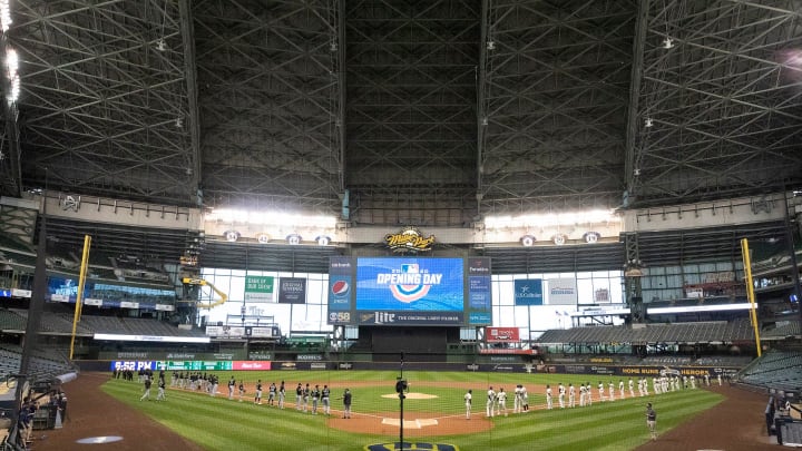 The Milwaukee Brewers and Chicago White Sox stand for the National Anthem opening day ceremonies on