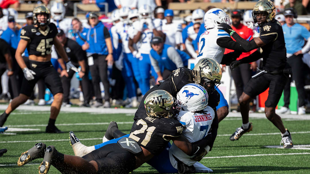 The Wake Forest defense makes a tackle on SMU. The Deacs won the game 13-12.