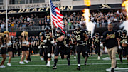The Wake Forest Demon Deacons take to the field in the game against North Carolina