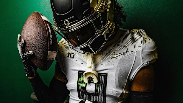 Nikko Reed models the "Fly Era" and "Warp Speed" uniform combination for Oregon Ducks Football's 2024 game against the Wiscon