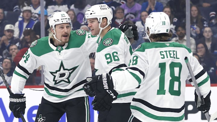 Oct 9, 2025; Winnipeg, Manitoba, CAN; Dallas Stars right wing Mikko Rantanen (96) celebrates his goal with Dallas Stars center Roope Hintz (24) and Dallas Stars center Sam Steel (18) against the Winnipeg Jets in the first period at Canada Life Centre. Mandatory Credit: James Carey Lauder-Imagn Images