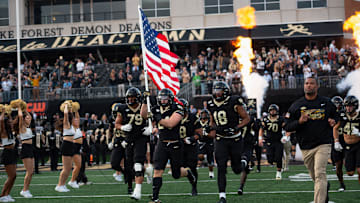 Wake Forest Demon Deacons take the field as they prepare to battle the UNC Tar Heels 