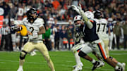 Wake Forest Quarterback Robby Ashford attempts a pass during the game against Virginia. 
