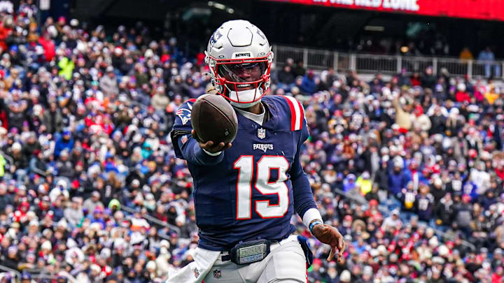 Jan 5, 2025; Foxborough, Massachusetts, USA; New England Patriots quarterback Joe Milton III (19) runs the ball for a touchdown against the Buffalo Bills in the first quarter at Gillette Stadium. Mandatory Credit: David Butler II-Imagn Images