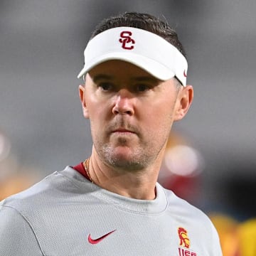 Oct 1, 2022; Los Angeles, California, USA;  USC Trojans head coach Lincoln Riley walks on the field before a game against the Arizona State Sun Devils at United Airlines Field at the Los Angeles Memorial Coliseum. Mandatory Credit: Jayne Kamin-Oncea-Imagn Images