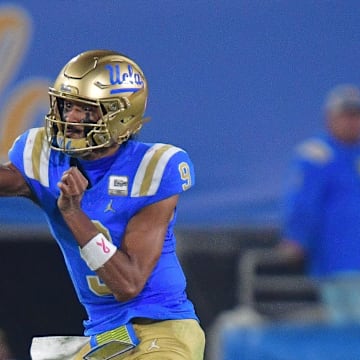 Nov 8, 2025; Pasadena, California, USA; UCLA Bruins quarterback Nico Iamaleava (9) throws against the Nebraska Cornhuskers during the second half at the Rose Bowl. Mandatory Credit: Gary A. Vasquez-Imagn Images