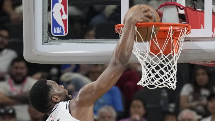 Apr 14, 2024; San Antonio, Texas, USA; San Antonio Spurs forward RaiQuan Gray (41) dunks during the first half against the Detroit Pistons at Frost Bank Center. Mandatory Credit: Scott Wachter-USA TODAY Sports