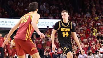 Dec 11, 2025; Ames, Iowa, USA; Iowa Hawkeyes guard Bennett Stirtz (14) sets the offense against the Iowa State Cyclones during the second half at James H. Hilton Coliseum. Mandatory Credit: Reese Strickland-Imagn Images