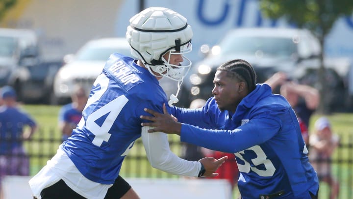 Bills defensive backs Cole Bishop, left, and Te'Cory Couch get in extra work on coverage before the start of day three of training camp.