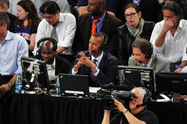 May 7, 2013; New York, NY, USA; Indiana Pacers former shooting guard Reggie Miller (center) commentates during the second half in game two of the second round of the 2013 NBA Playoffs between the New York Knicks and Indiana Pacers at Madison Square Garden. Knicks won the game 105-79. Mandatory Credit: Joe Camporeale-USA TODAY Sports