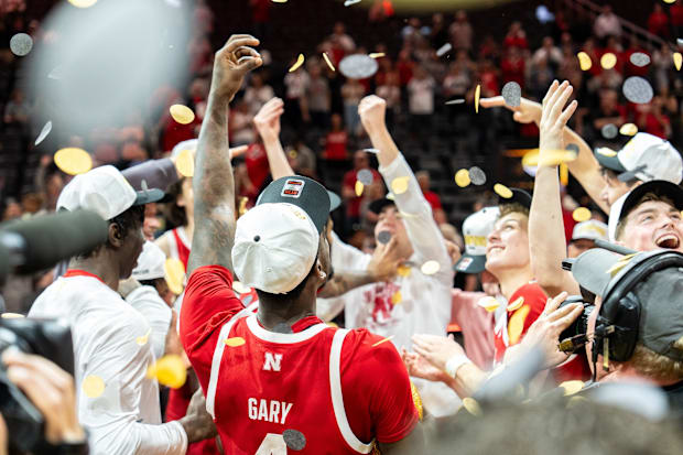 Nebraska forward Juwan Gary celebrates with the team as confetti falls after winning the College Basketball Crown .