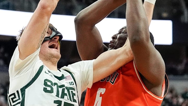 Michigan State center Carson Cooper (15) defends Bowling Green forward Marcus Johnson (6) during the second half at Breslin Center in East Lansing on Saturday, Nov. 16, 2024.