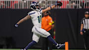 Dec 7, 2025; Atlanta, Georgia, USA; Seattle Seahawks wide receiver Jaxon Smith-Njigba (11) scores a touchdown against the Atlanta Falcons in the third quarter at Mercedes-Benz Stadium. 