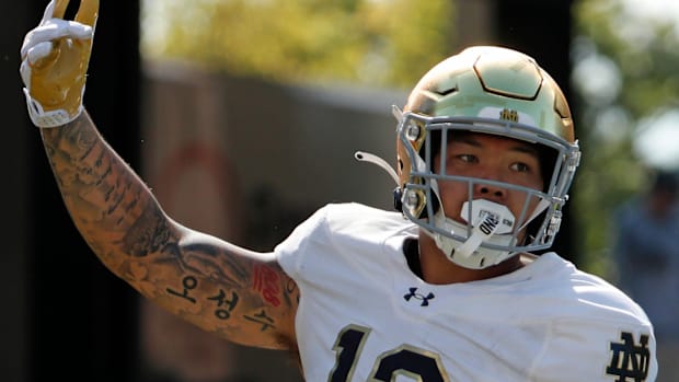 Jordan Botelho celebrates a Notre Dame stop against Purdue in 202