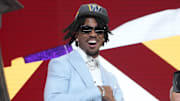 Apr 25, 2024; Detroit, MI, USA; LSU Tigers quarterback Jayden Daniels reacts after being selected by the Washington Commanders as the No. 2 pick in the first round of the 2024 NFL Draft at Campus Martius Park and Hart Plaza. Mandatory Credit: Kirby Lee-Imagn Images