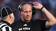 Sep 20, 2025; Durham, North Carolina, USA;  NC State Wolfpack head coach Dave Doeren reacts to a call during the fourth quarter against the Duke Blue Devils at Wallace Wade Stadium. Mandatory Credit: Zachary Taft-Imagn Images