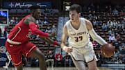 Dec 20, 2017; Uncasville, CT, USA; St. Joseph's Hawks forward Taylor Funk (33) dribbles the ball against St. John's Red Storm forward Marvin Clark II (13) during the second half at Mohegan Sun Arena. Mandatory Credit: Gregory J. Fisher-Imagn Images